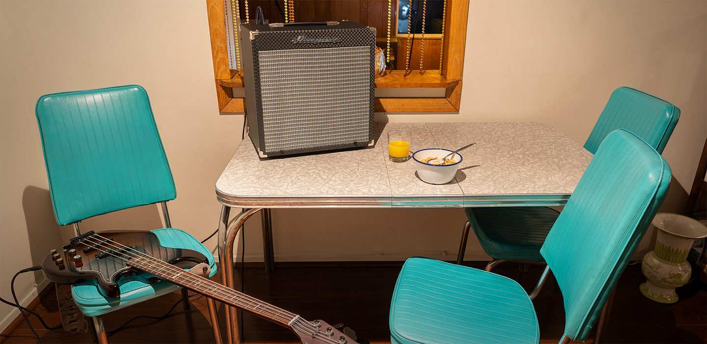 Ampeg RB-108 on Kitchen table next to bowl of cereal