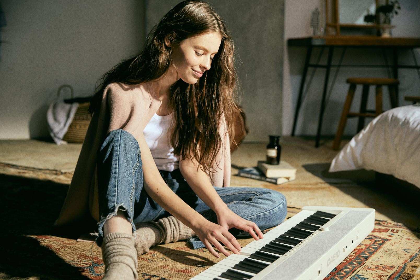 Girl playing White CT-S1 Casio Keyboard
