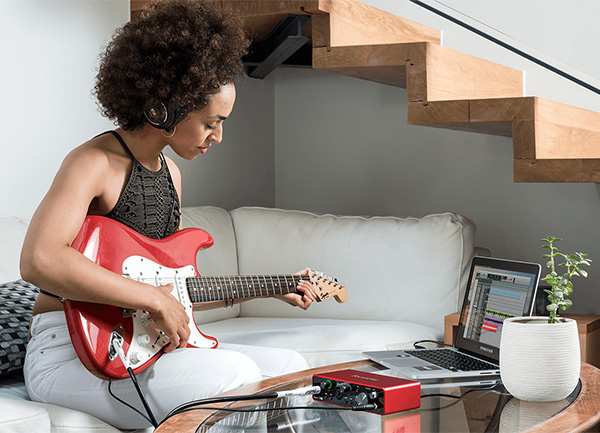Girl Playing Electric Guitar with Scarlett Interface