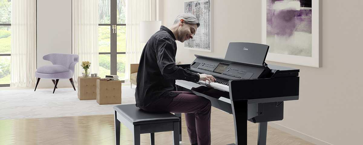 person playing CVP Clavinova in home environment
