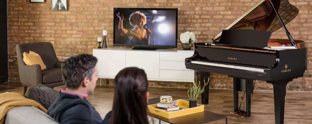 People enjoying Piano with TV Synch in living room