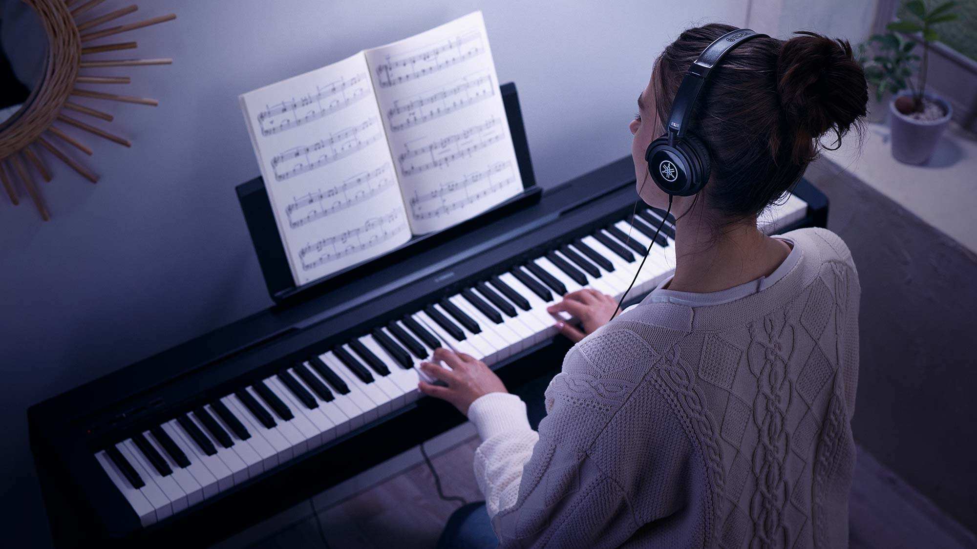 Yamaha P45 being played in headphones