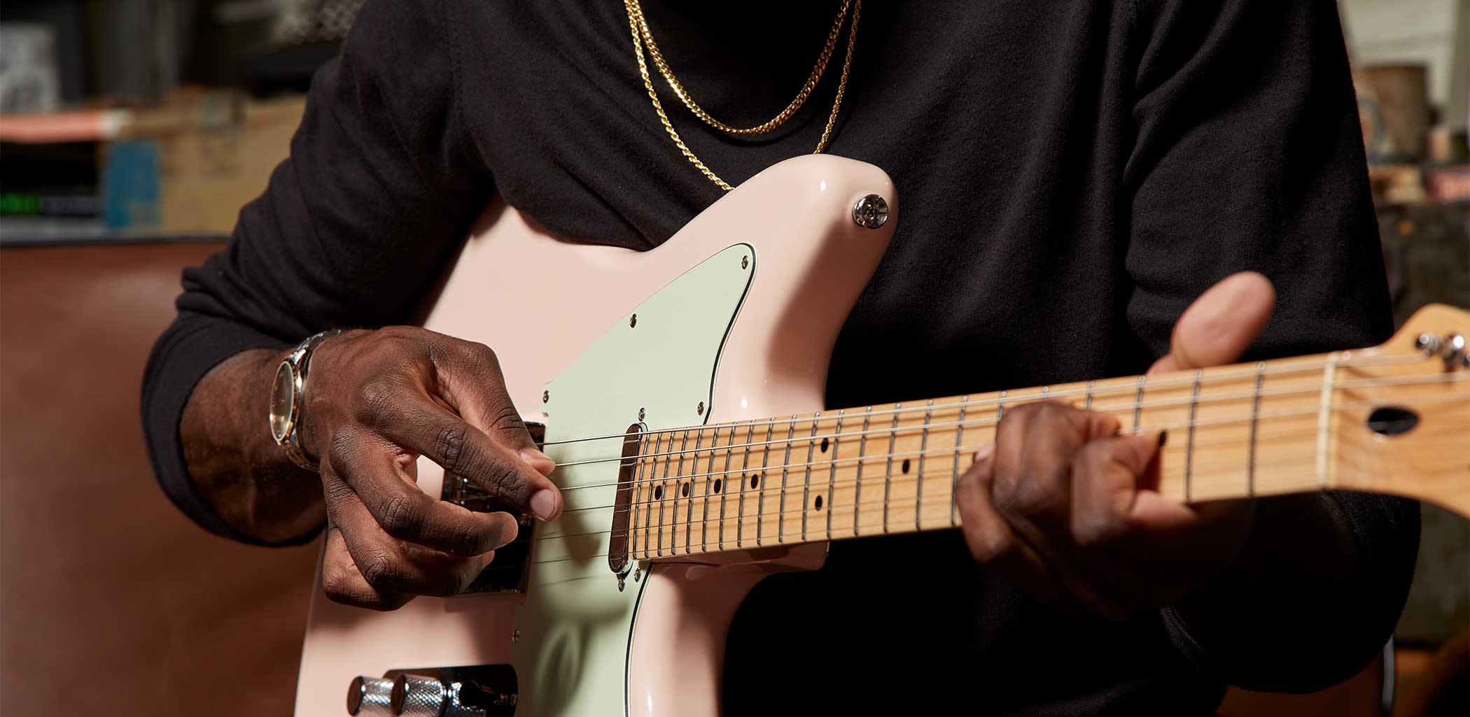 Squier Pink Offset Guitar Close Up Being Played
